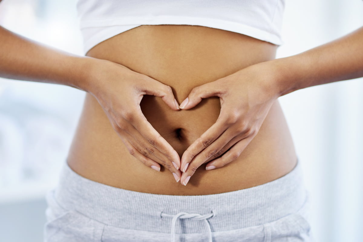 Woman with Hands on Healthy Happy Gut